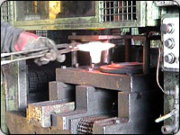 The machine must stop so that a person can safely reach into the area to load and unload the product. The machine then has to be restarted after the product has been changed and the area is made safe.